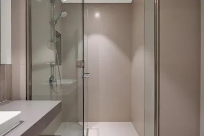 a shower with a glass door in a bathroom at Luxurious, Creek & Marina View in Dubai
