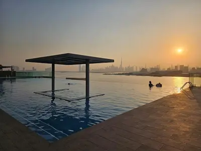 a pool of water with a person in the water at Luxurious, Creek & Marina View in Dubai