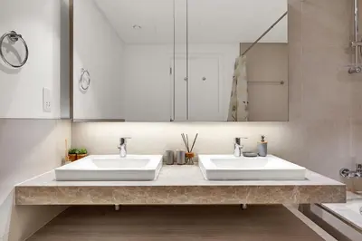 a bathroom with two sinks and a mirror at Luxurious, Creek & Marina View in Dubai