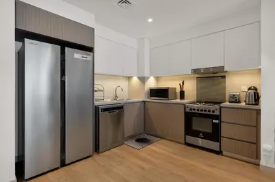 a kitchen with a stainless steel refrigerator and appliances at Luxurious, Creek & Marina View in Dubai
