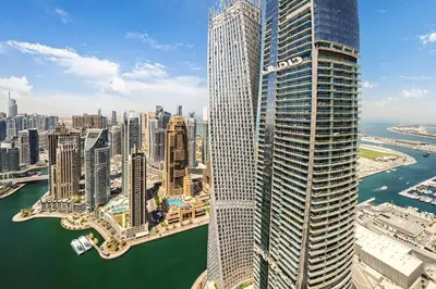 an aerial view of a city with a large skyscraper at The Marina Observatory-Jumeirah Living Marina Gate in Dubai