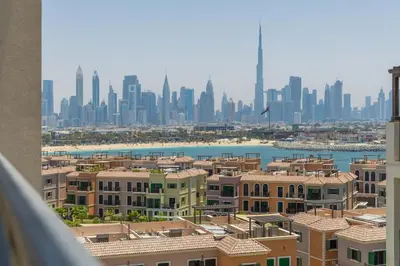 a view of a city with buildings and a harbor at WOW Port de la Mer Skyline Blick Dubai in Dubai