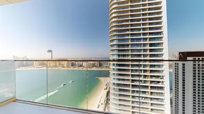 a view of the ocean from the balcony of a building at Grand Bleu 2 - Sophisticated Two Bed with Sea View in Dubai