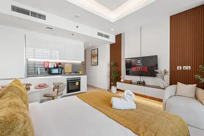 a bedroom with a bed with a towel on it at Luxurious New Studio! 2 Double Beds! Sleek Design & High-End Amenities in Dubai Downtown in Dubai