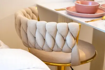 aige chair with a counter with a table at Luxurious New Studio! 2 Double Beds! Sleek Design & High-End Amenities in Dubai Downtown in Dubai
