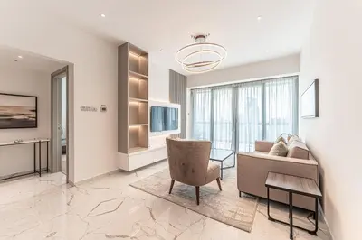 a living room with a couch and a table at HAVN - Upgraded 1 Bed in 8 Boulevard Walk Downtown in Dubai