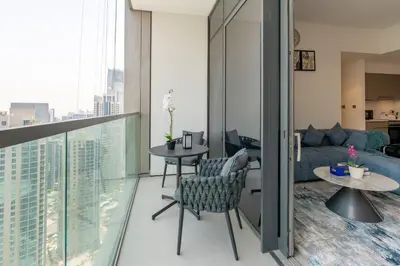 a living room with a view of a city at Burj & Fountain View Retreat in Dubai