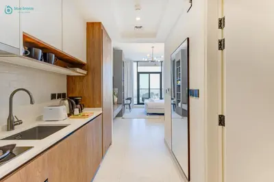 a kitchen with a sink and a counter at Bright & Luxury Studio with Balcony in Al Furjan in Dubai