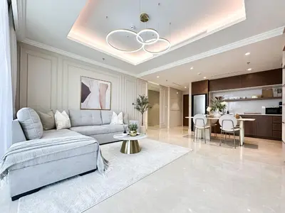 a living room with a couch and a table at Seaside Elegance 1BR Luxury Apartment with Private Beach Access, Emaar Beachfront in Dubai