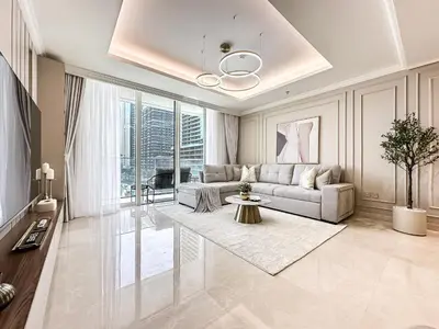 a living room with a couch and a table at Seaside Elegance 1BR Luxury Apartment with Private Beach Access, Emaar Beachfront in Dubai
