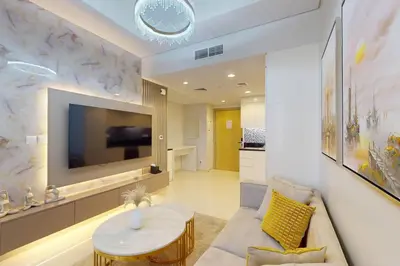 a living room with a couch and a table at Family Apartment near Dubai Mall in Dubai