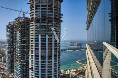 a view of a tall building in a city at Luxurious 1BR in Palm View with Palm Jumeirah Views in Dubai