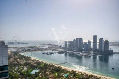 an aerial view of a city with a river and buildings at Luxurious 1BR in Palm View with Palm Jumeirah Views in Dubai