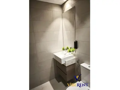 a bathroom with a sink and a mirror at 2BR Sofa Bed Sleep 6 Furjan in Dubai