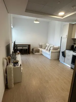 a living room with a couch and a table at The Nook 2 - 2 bed flat near Dubai Marina in Dubai