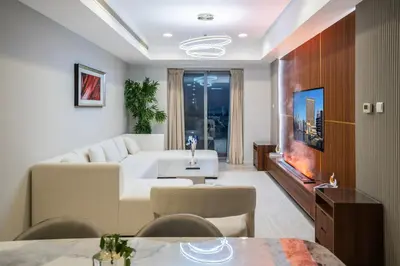 a living room with a couch and a tv at 13P-Sea View Apartment in Dubai Marina with Pool & Balcony in Dubai