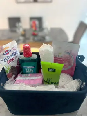 a blue basket filled with different types of food at 5 Min Downtown in Dubai