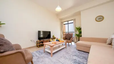 a living room with a couch and a table at Luxury Casa - Paramount Sea View Apartment 2BR in Dubai