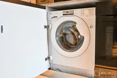 a washer and dryer in a utility room at Modern Studio in Arjan by Deleguest in Dubai