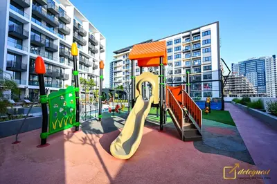 a playground in a city with a slide at Modern Studio in Arjan by Deleguest in Dubai