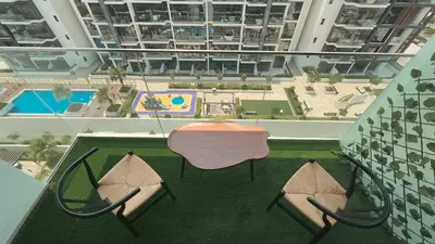 an overhead view of a patio with a table and chairs at Relaxing Retreat in Meydan in Dubai