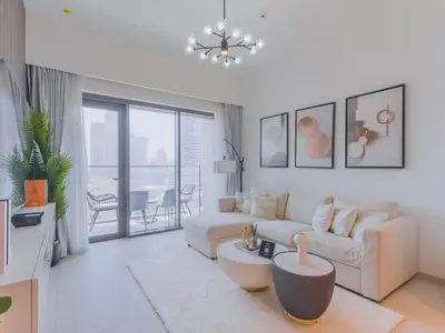 a living room with a couch and a table at TRPS - Burj Royale, Downtown Dubai - 2BR - Burj Khalifa View - Furnished & Ready in Dubai