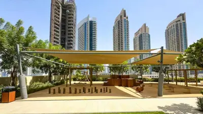 a pavilion in a city with tall buildings at TRPS - Burj Royale, Downtown Dubai - 2BR - Burj Khalifa View - Furnished & Ready in Dubai