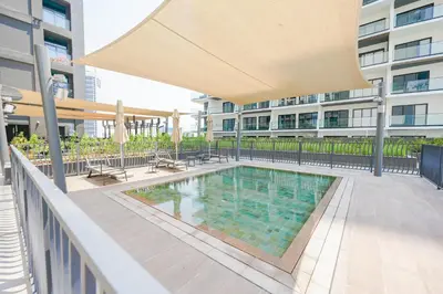 a swimming pool on the balcony of a building at Stylish Retreat in Business Bay in Dubai