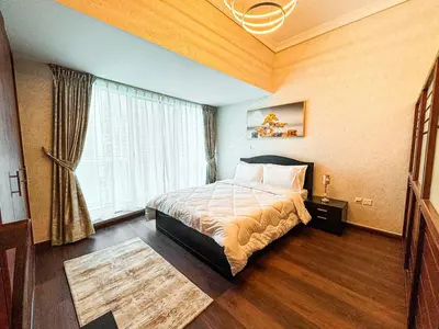 a hotel room with a bed and a window at Fully Furnished Studio Lake Terrace, JLT Prime Location by Al sarya Holiday Homes in Dubai