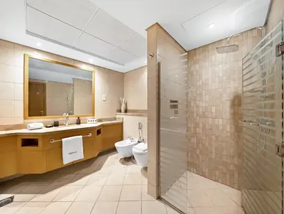 a bathroom with a toilet and a sink and a shower at WonderfulStay at Marine Towers - Full Ain & Marina View - JBR Grande Living - Brand New Apartments in Dubai