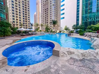 a large swimming pool in a city with tall buildings at WonderfulStay at Marine Towers - Full Ain & Marina View - JBR Grande Living - Brand New Apartments in Dubai