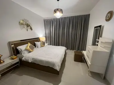 a bedroom with a large bed and a window at Elegant 1 Bedroom Apartment, The Lofts West Tower, Downtown Dubai By Al sarya Holiday Homes in Dubai