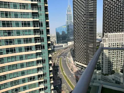 a view of a city with tall buildings at Elegant 1 Bedroom Apartment, The Lofts West Tower, Downtown Dubai By Al sarya Holiday Homes in Dubai