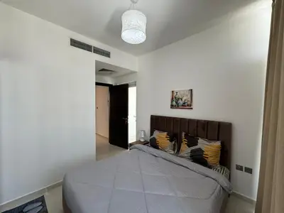 a bedroom with a bed in a room at 3 Bedroom Villa in Vardon Cluster Damac Hills 2 Peaceful Family Retreat By al sarya Holiday Homes in Dubai