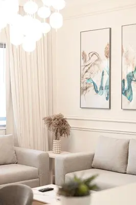 a living room with a couch and a table at Damac Maison Mall Street! 2 Bedroom, 1-minute to Dubai Mall! in Dubai
