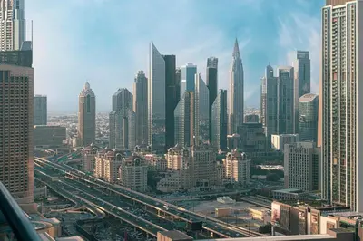 a view of a large city with buildings at Damac Maison Mall Street! 2 Bedroom, 1-minute to Dubai Mall! in Dubai