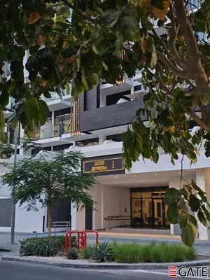 a building with a sign in front of it at EGATE - Studio - 10th Floor - Balcony with a View - 01-1014 in Dubai