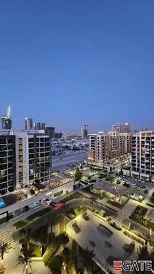 an aerial view of a city with tall buildings at EGATE - Studio - 10th Floor - Balcony with a View - 01-1014 in Dubai