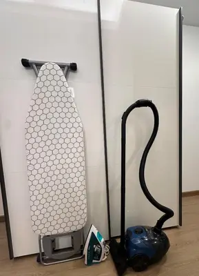 a video game controller next to a wall at Cozy Studio Apartment in Dubai