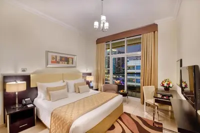 a bedroom with a large bed and a large window at Luxury Casa - Marina Diamond 2 in Dubai