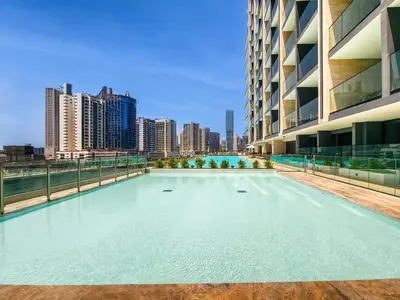 a swimming pool in the middle of a building with a city at Trillionaire Business Bay with Private Jacuzzi in Dubai