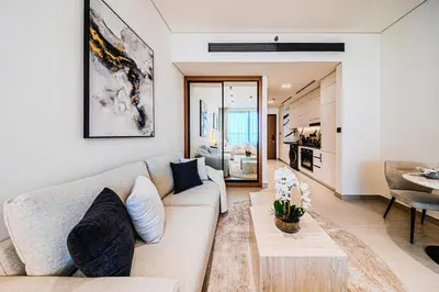 a living room with a couch and a table at Trillionaire Business Bay with Private Jacuzzi in Dubai