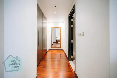 a hallway of a home with wooden floors at Steps to Beach - Resort Residence - Palm Jumeirah in Dubai
