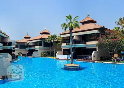 a large swimming pool in front of some buildings at Steps to Beach - Resort Residence - Palm Jumeirah in Dubai