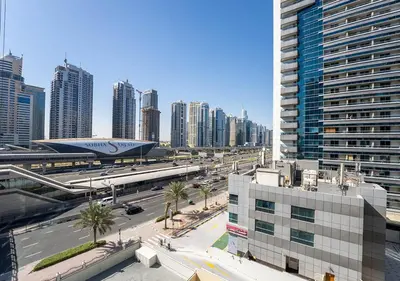 a view of a city with tall buildings and a street at 1BR Elegant Apartment in Marina Diamond 3 Metro Access in Dubai