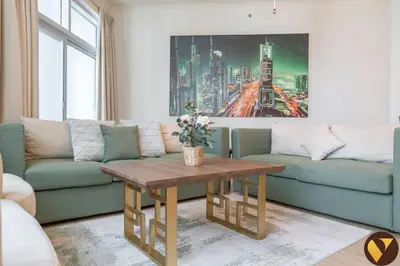 a living room with a couch and a table at Vogue Marina Torch Tower near JBR Beach and Dubai Marina Mall, Two Bedroom Apartment with Balcony and City Skyline View, Access to all Amenities in Dubai