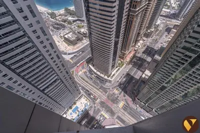 an aerial view of a city with tall buildings at Vogue Marina Torch Tower near JBR Beach and Dubai Marina Mall, Two Bedroom Apartment with Balcony and City Skyline View, Access to all Amenities in Dubai