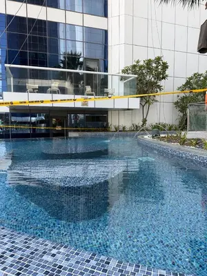 a large swimming pool in front of a building at 4905 Luxury View By Royal Sky Vacation Homes Paramount Tower A in Dubai