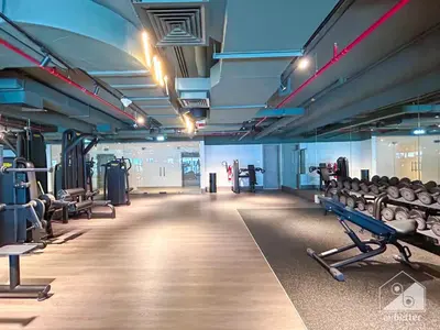 a gym with rows of chairs and machines in it at Sterling East Prime Location ST in Business Bay in Dubai