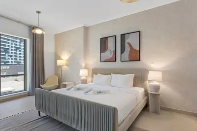a hotel room with a bed and a window at Exceptional 1-bedroom with pool view in Downtown in Dubai